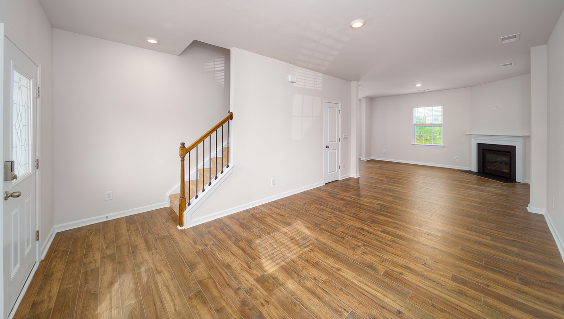 Family room with large windows and fireplace