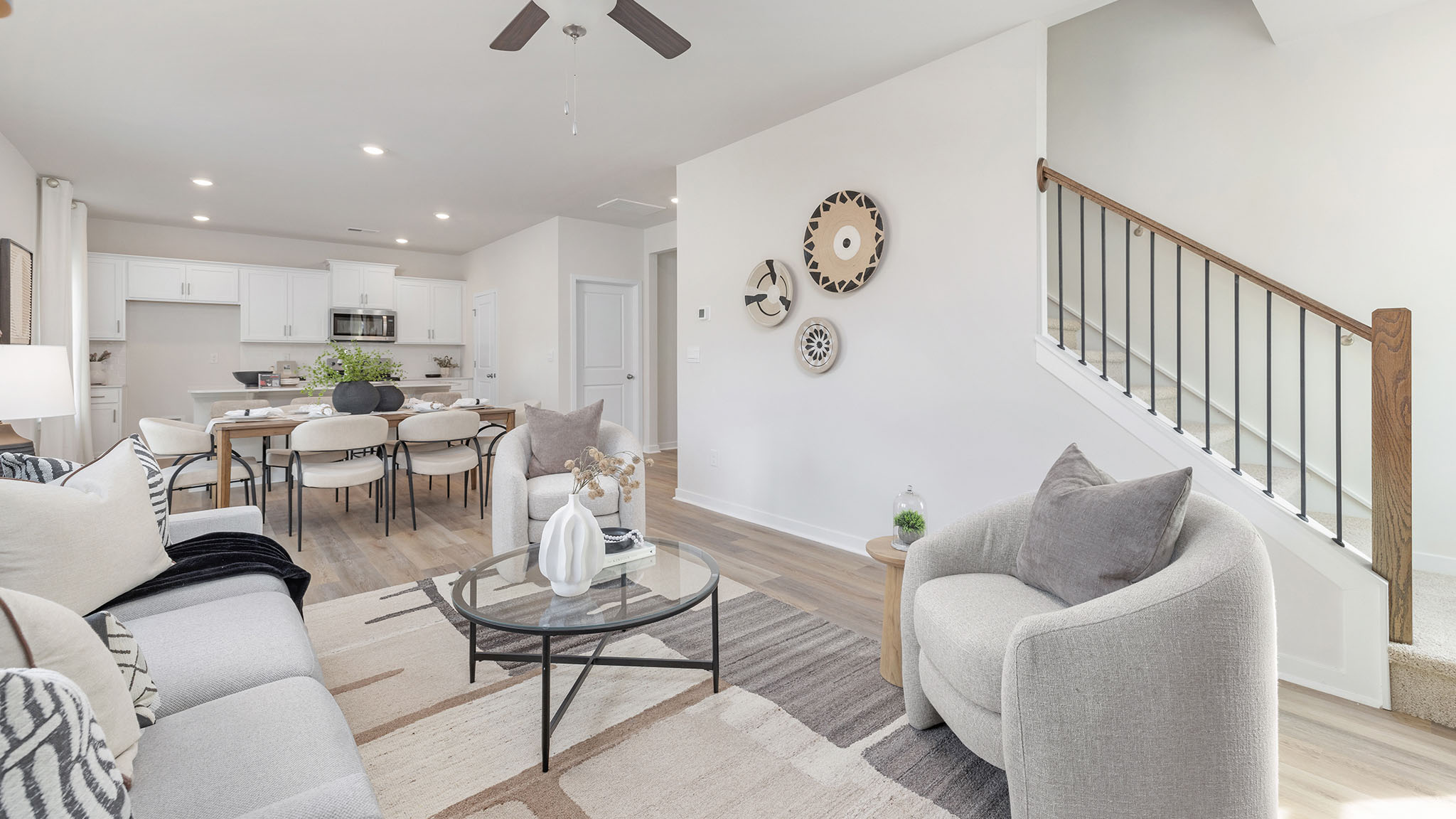 living room with wood floors, electric fireplace and large window