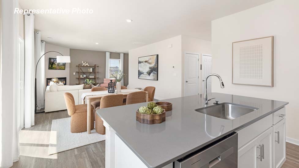 Kitchen and island with stainless steel appliances