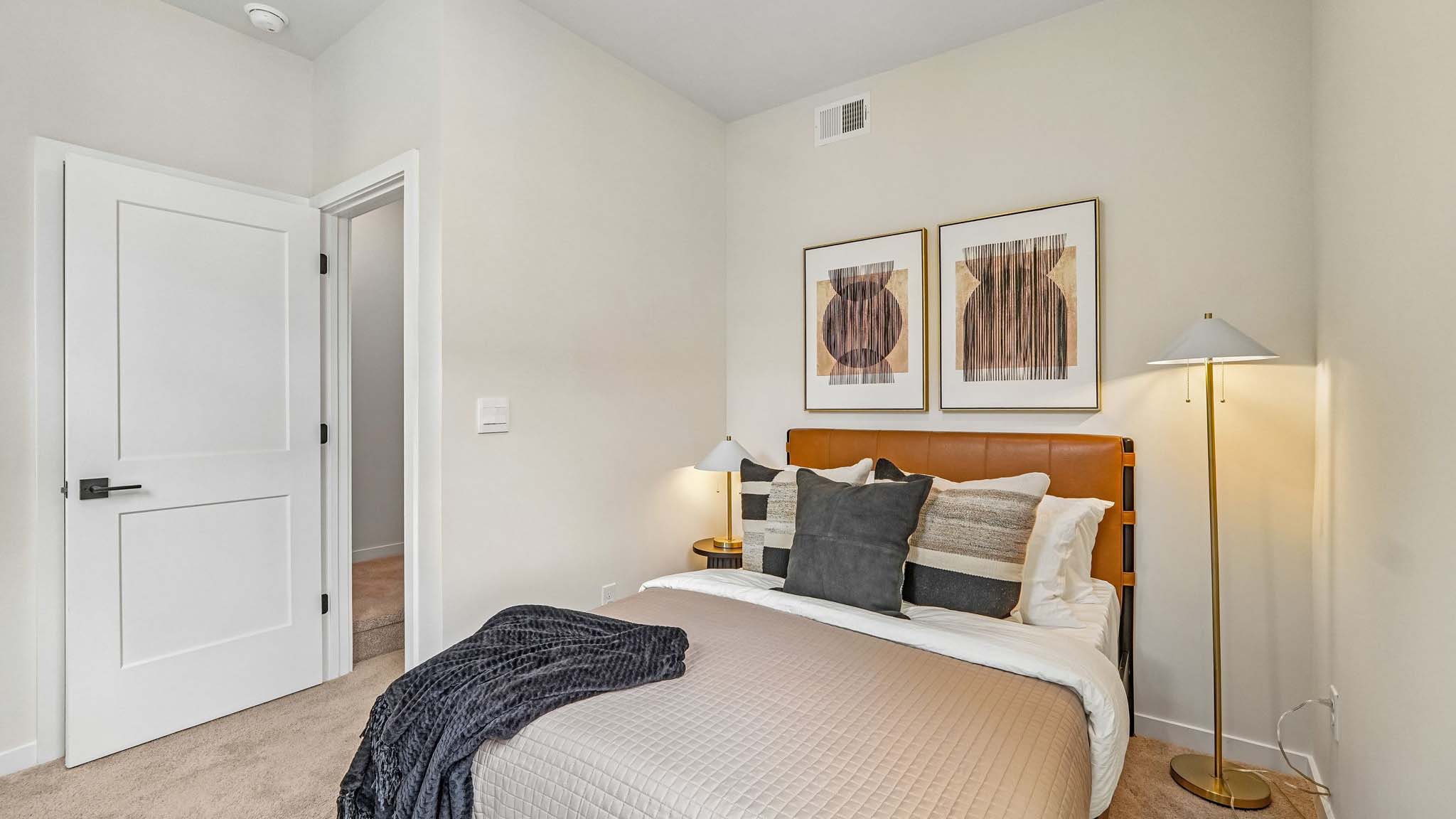Carpeted bedroom with windows