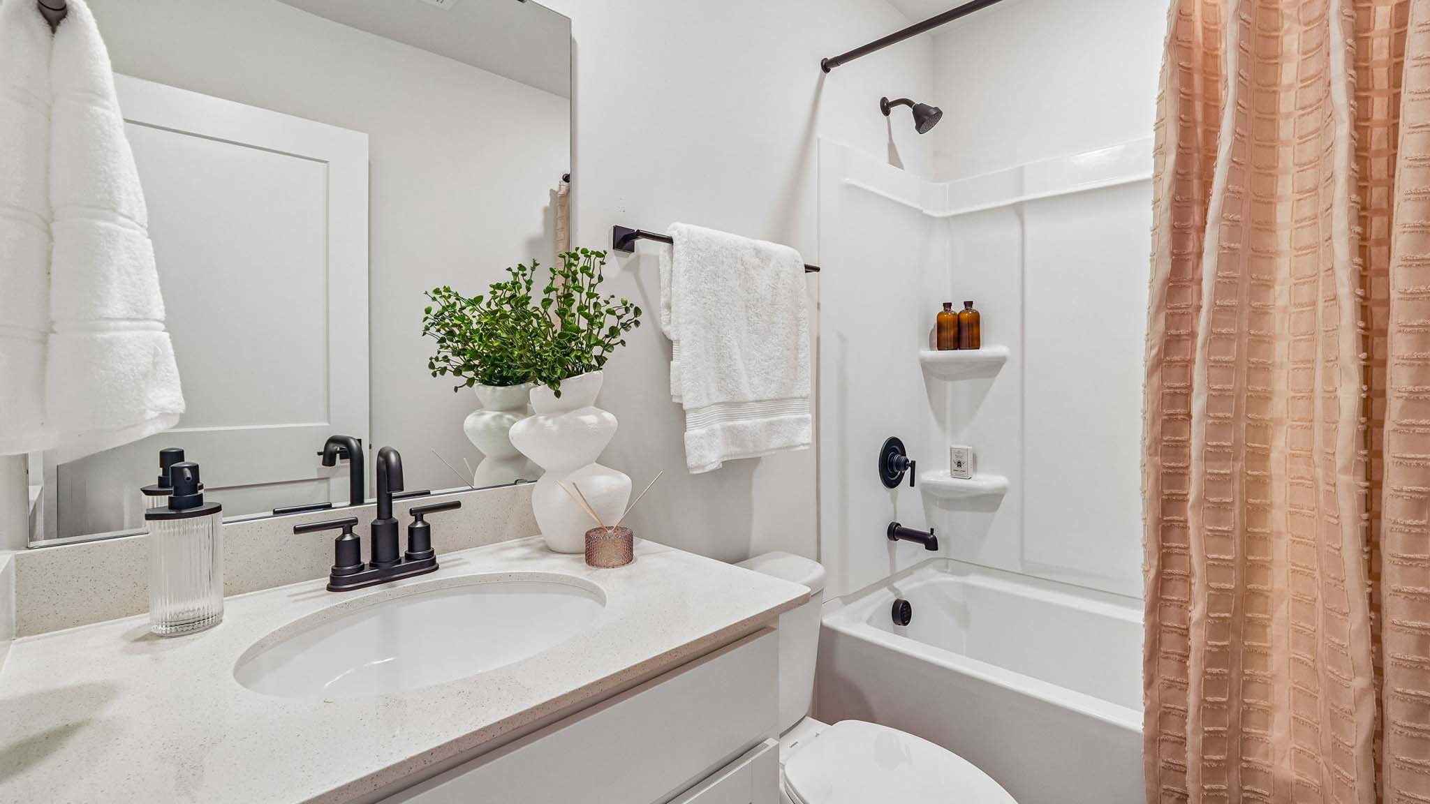 Bathroom with single sink and tub shower
