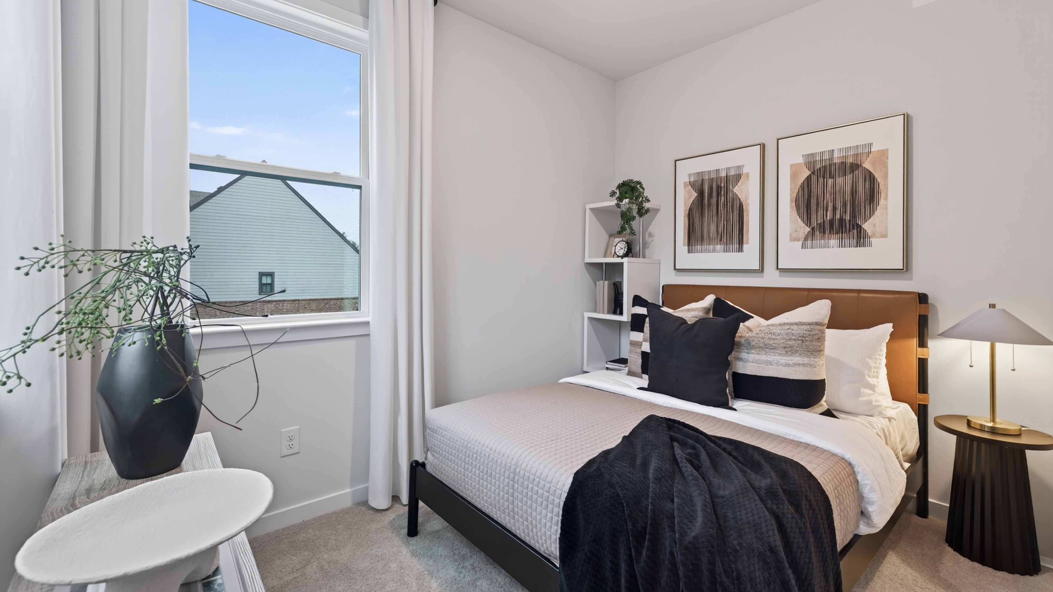 Carpeted bedroom with windows