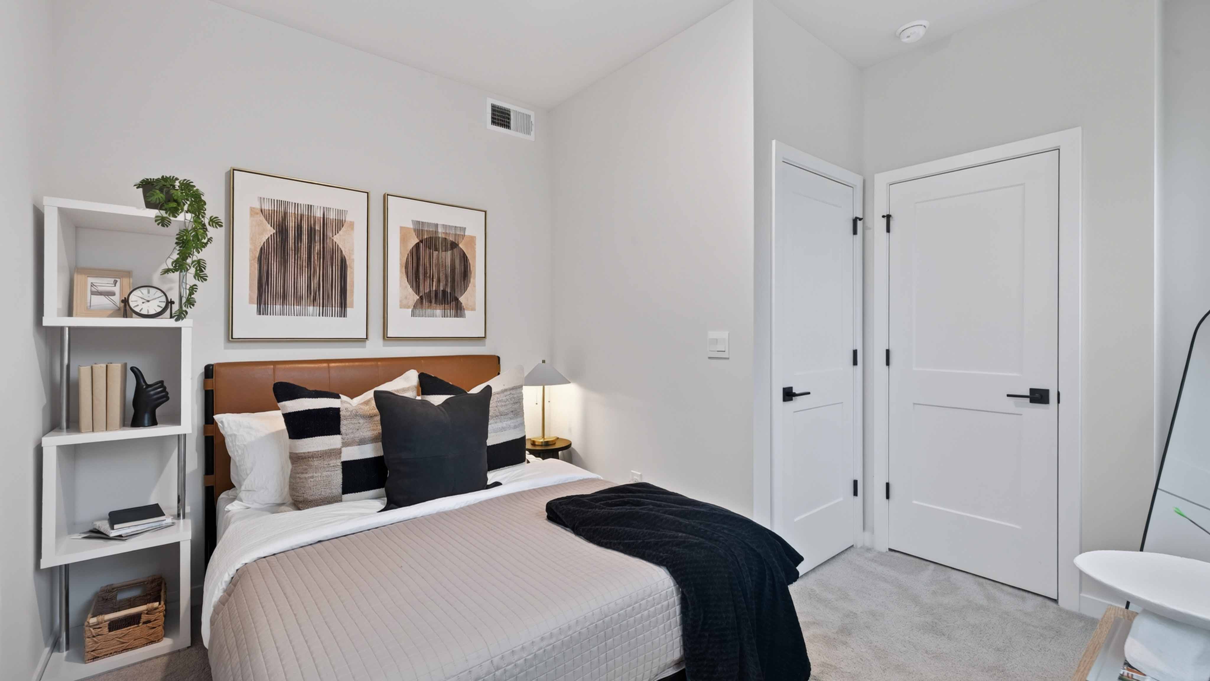 Carpeted bedroom with windows