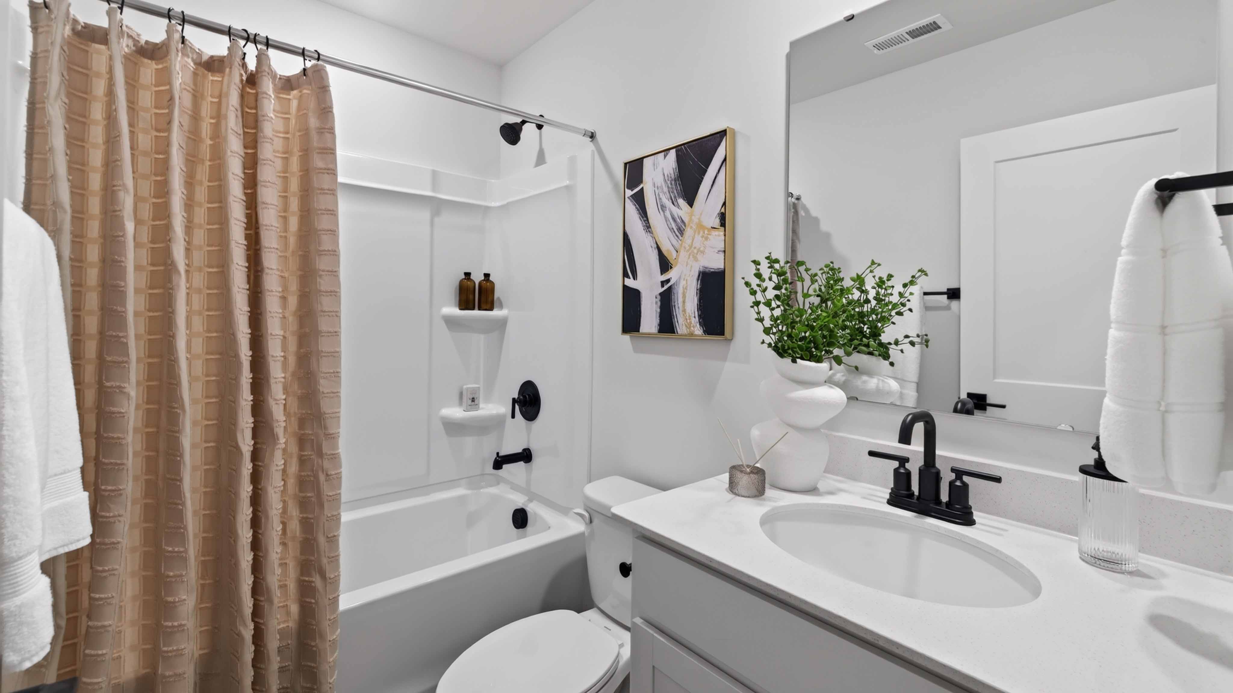 Bathroom with single sink and tub shower