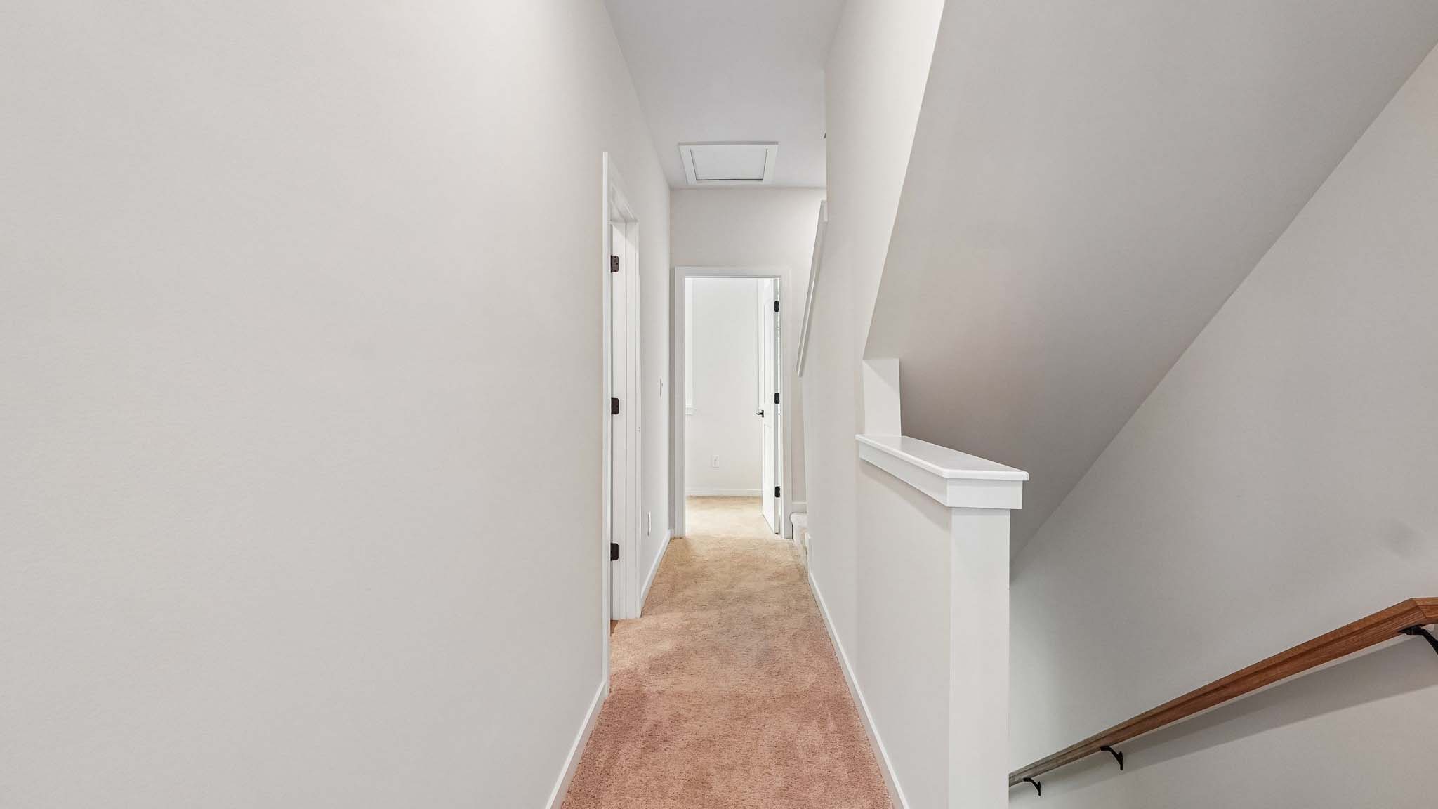 Hallway with view of stairs