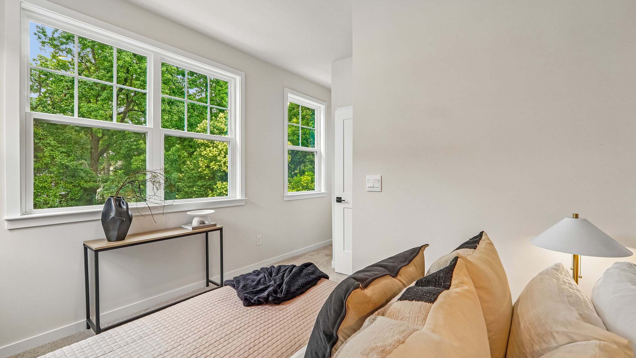 Carpeted bedroom with windows