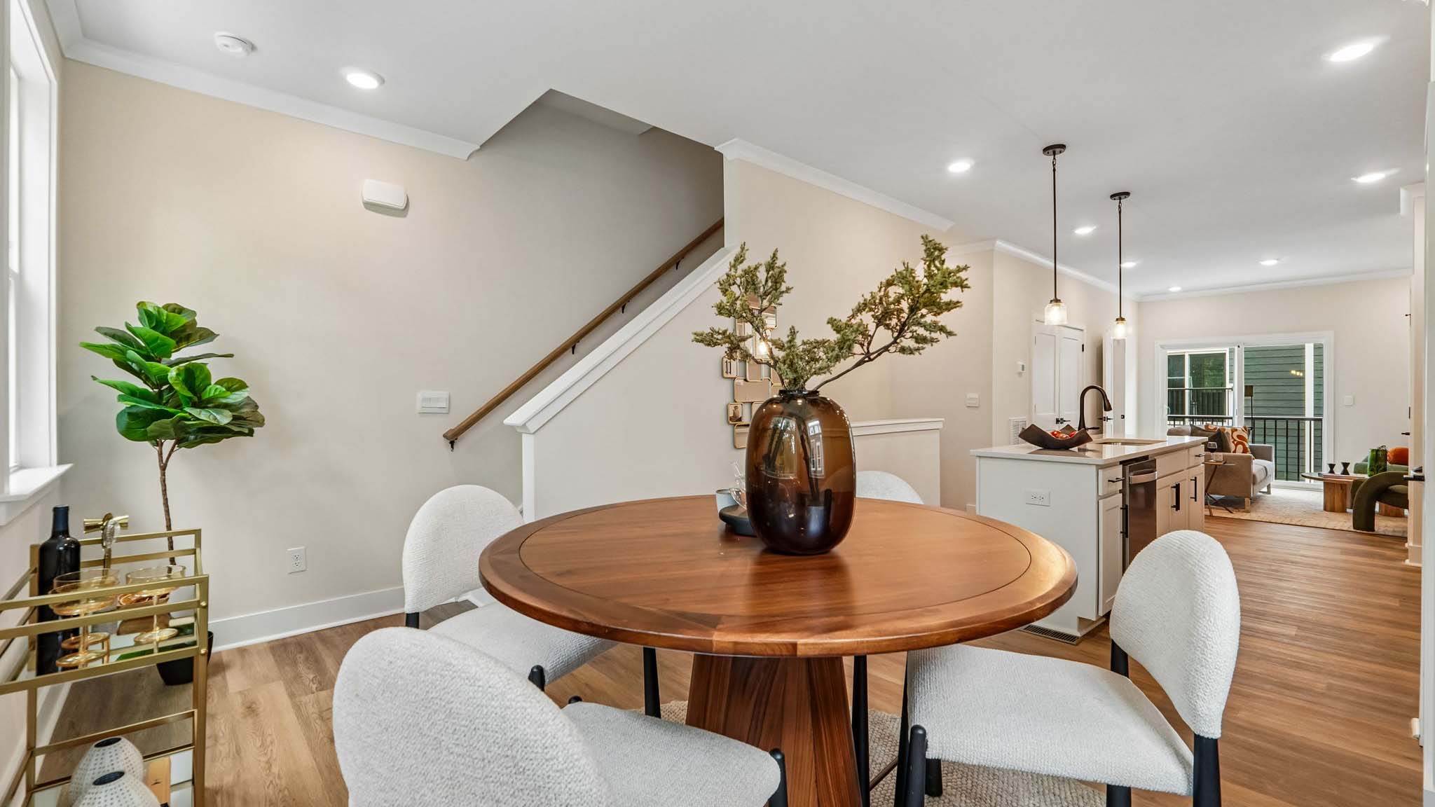 Dining area with windows and view of stairs