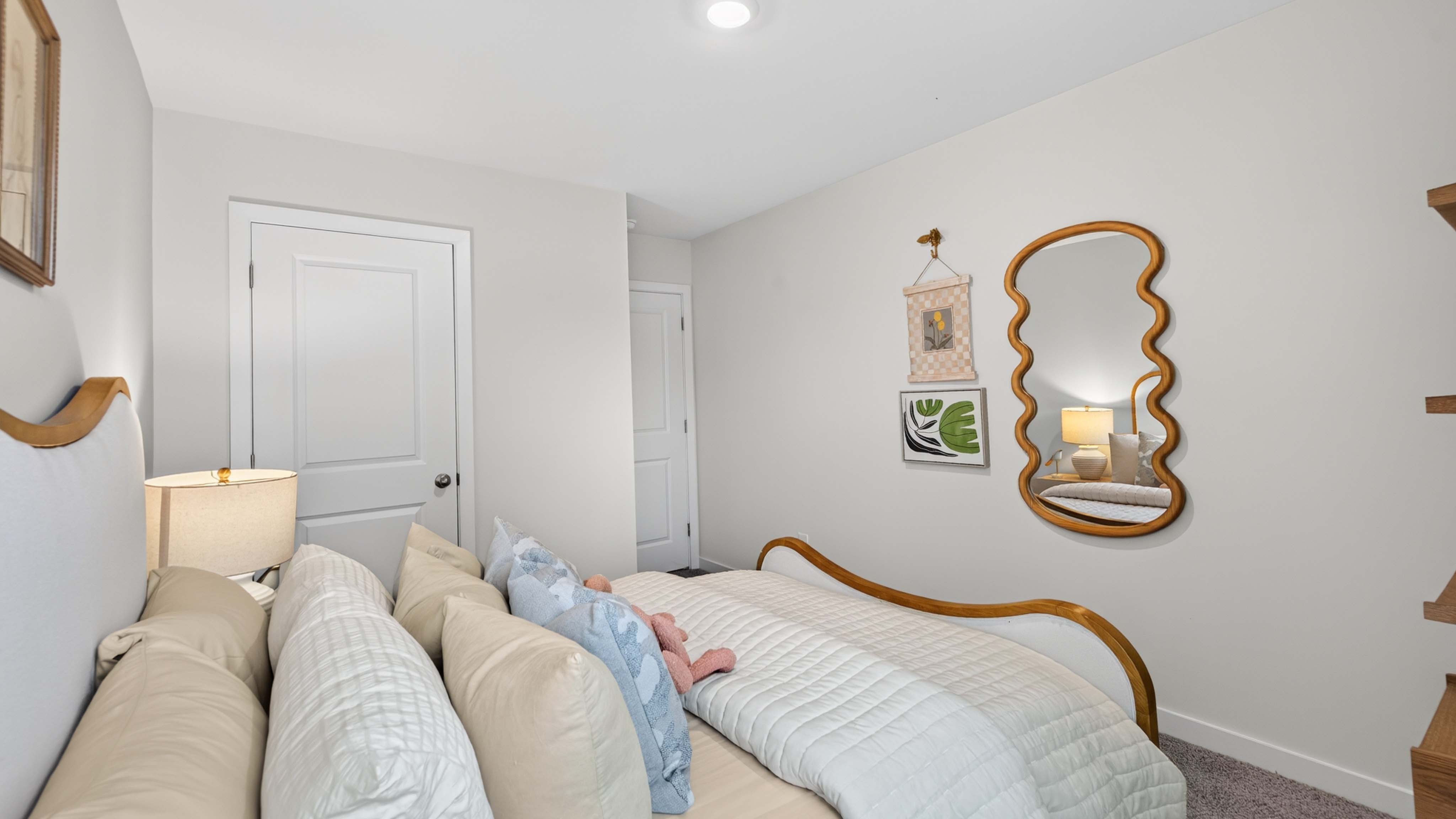 carpeted bedroom with small window