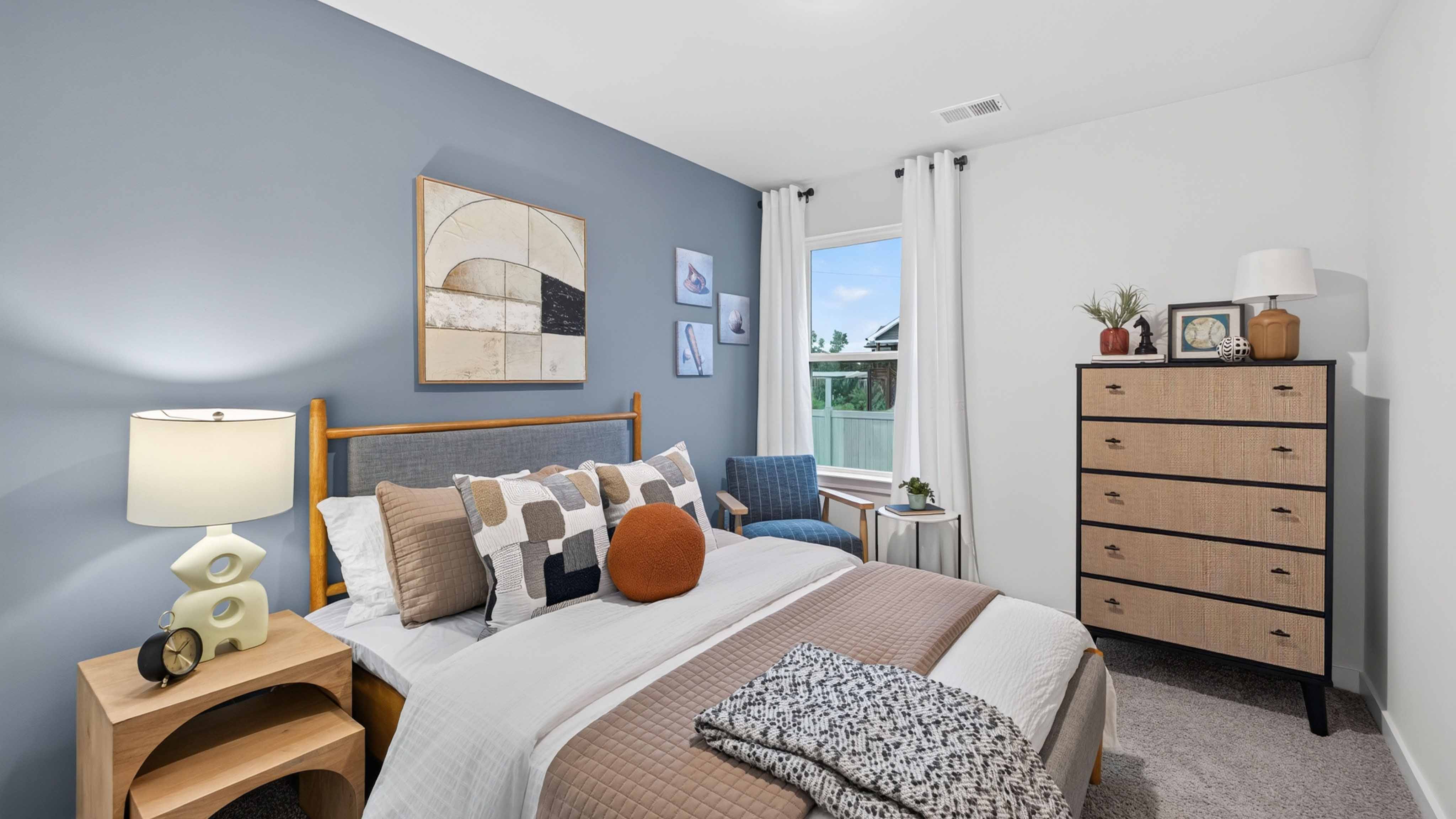 carpeted bedroom with small window