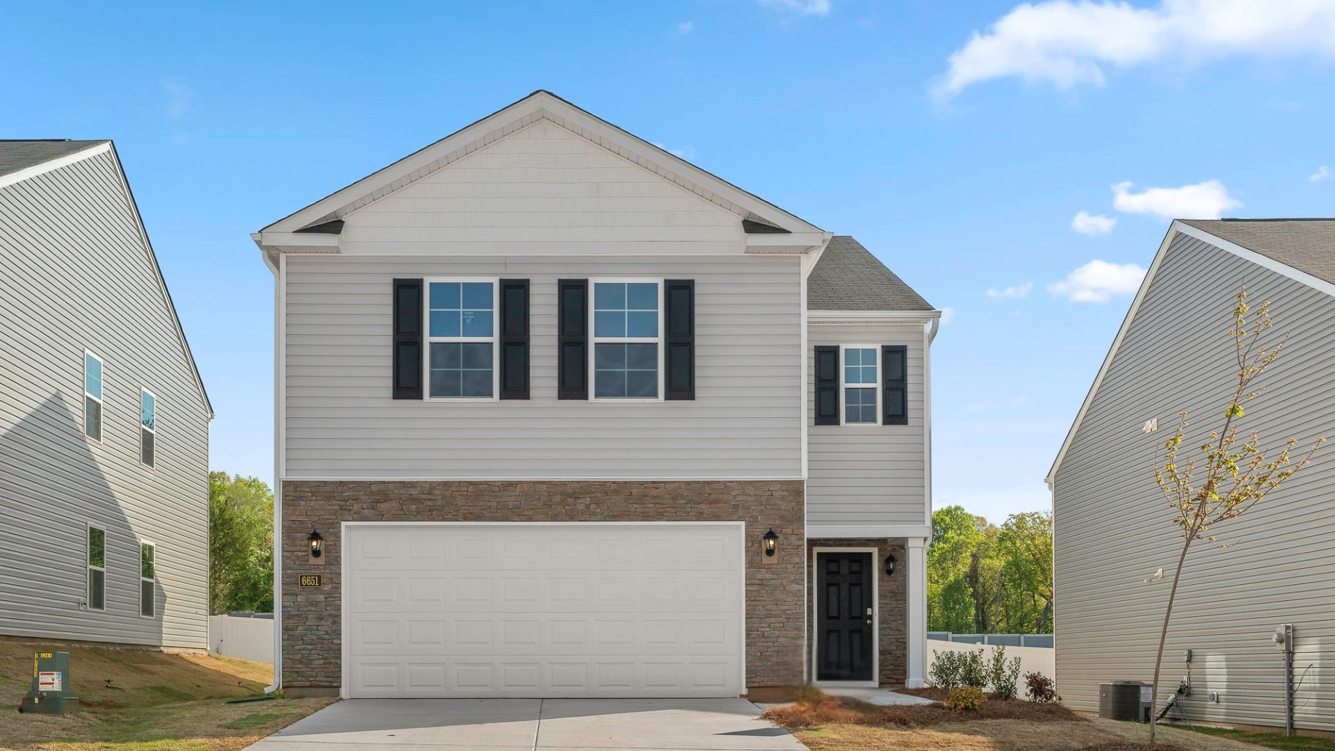 2 story home with vinyl and brick