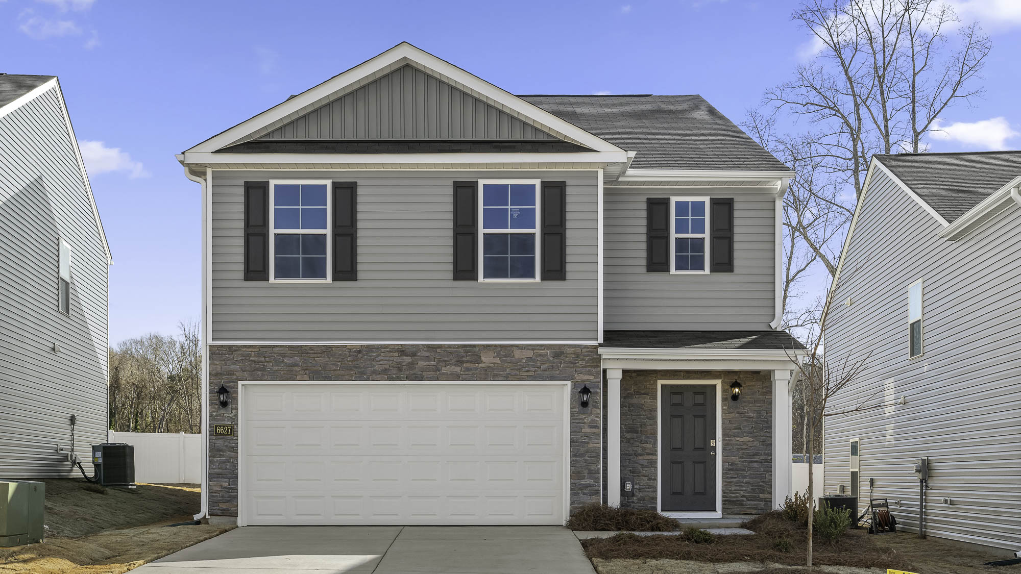 2 story home with vinyl with brick