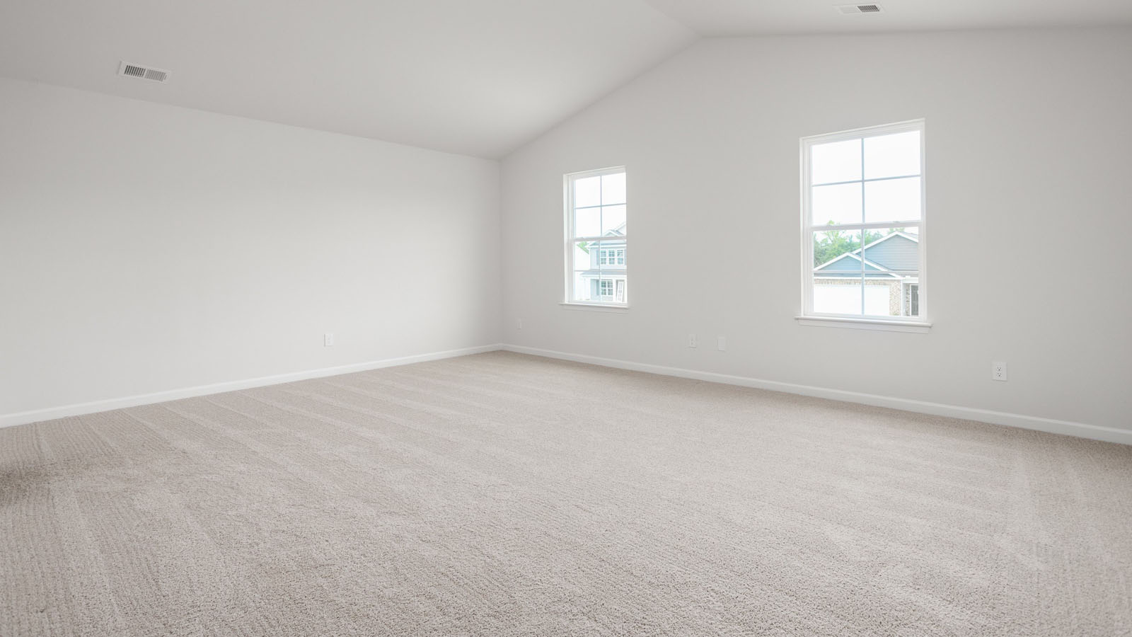 primary bedroom with windows