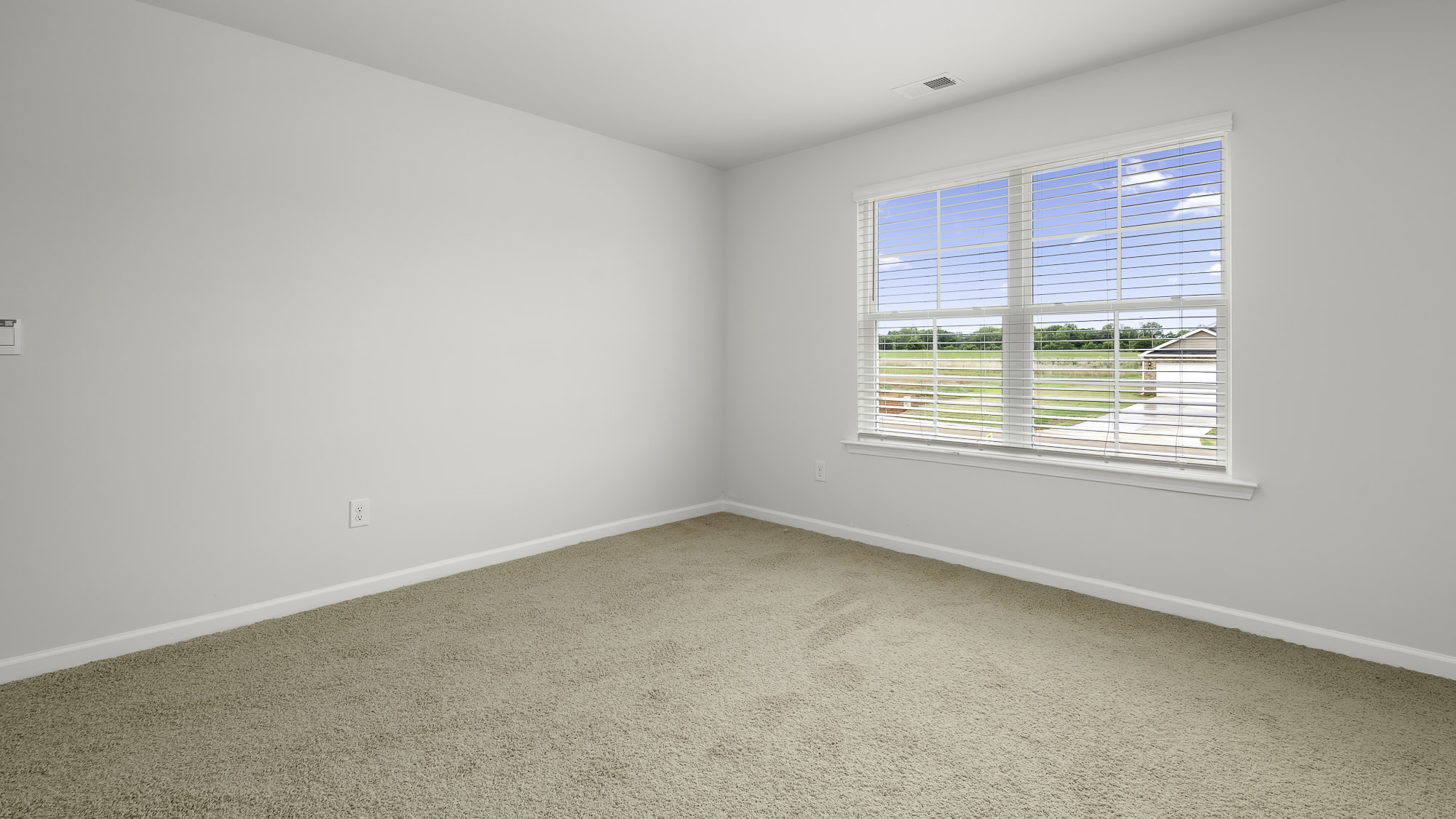 bedroom with carpet and window