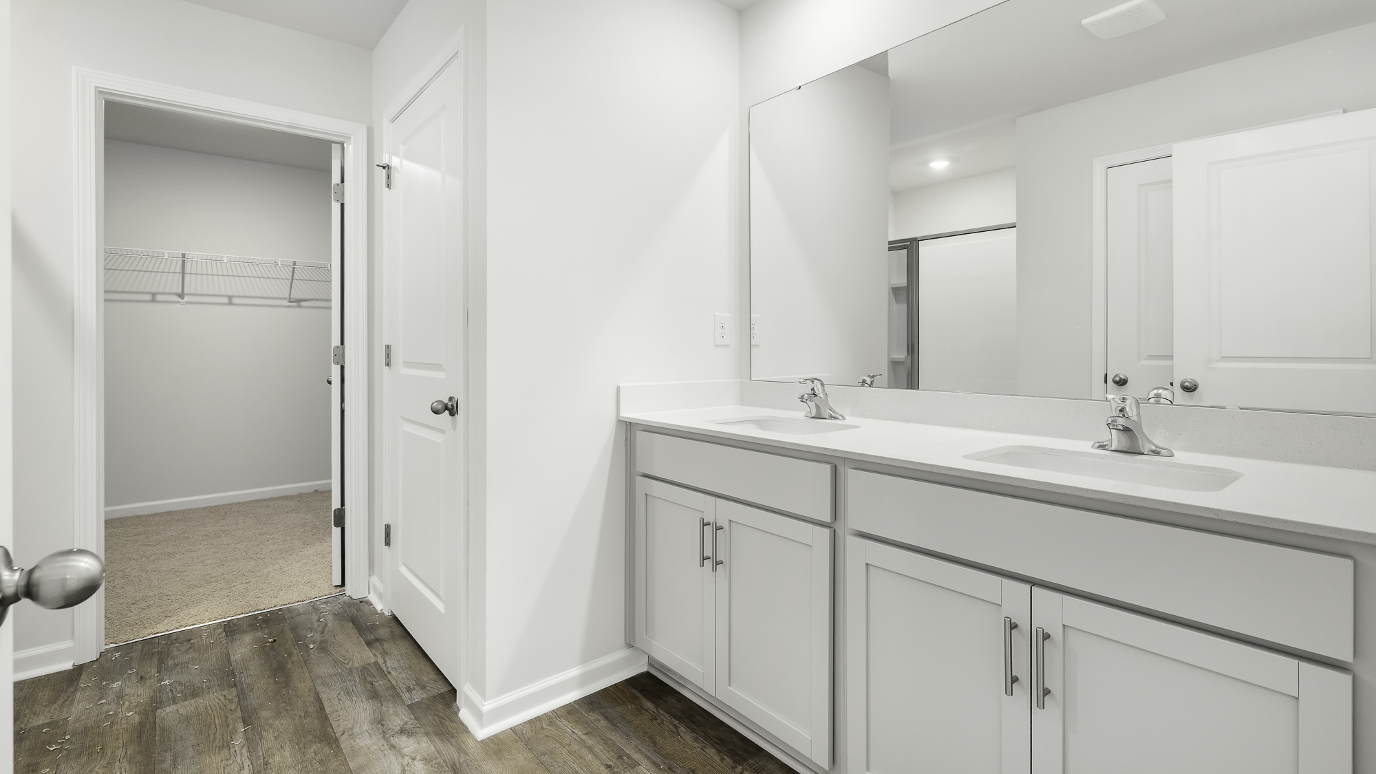primary bathroom with dual sinks