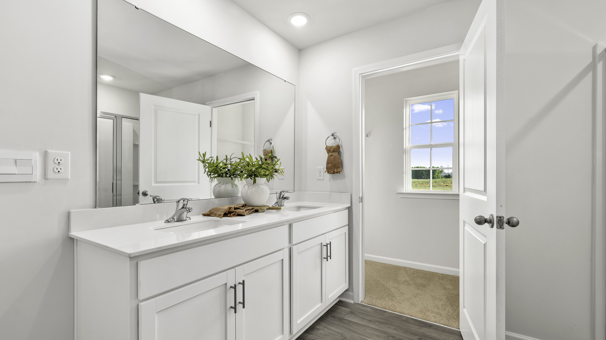 primary bathroom with dual sinks