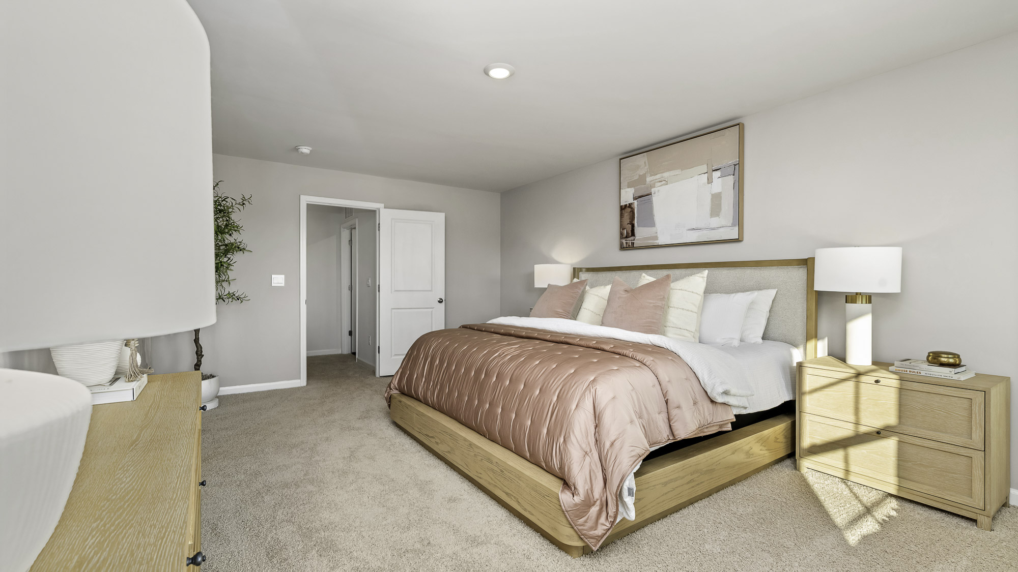 additional view of primary bedroom with carpet