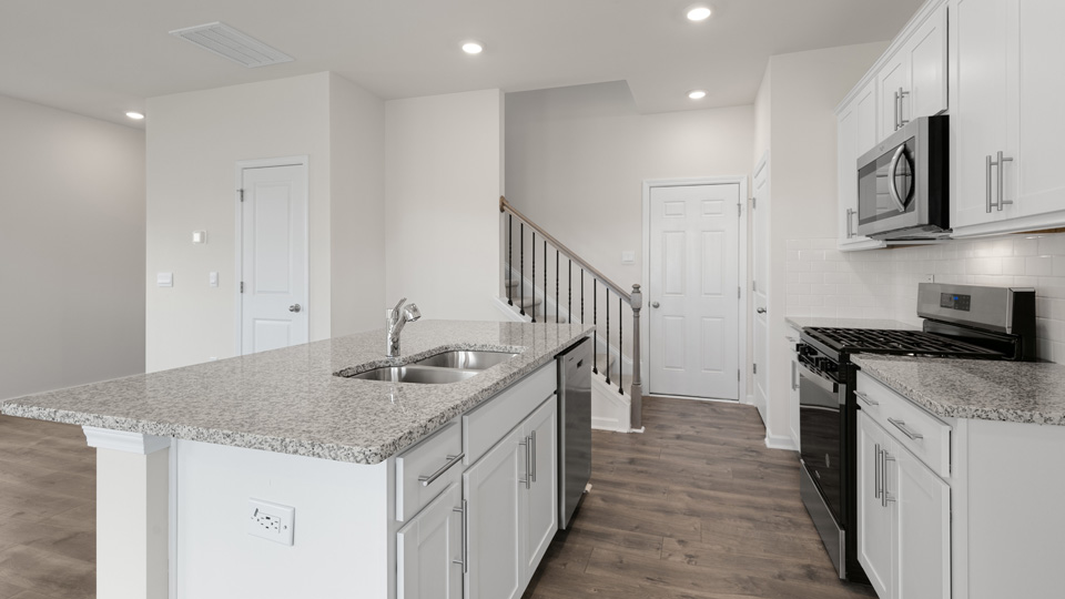 middle kitchen with white cabinets