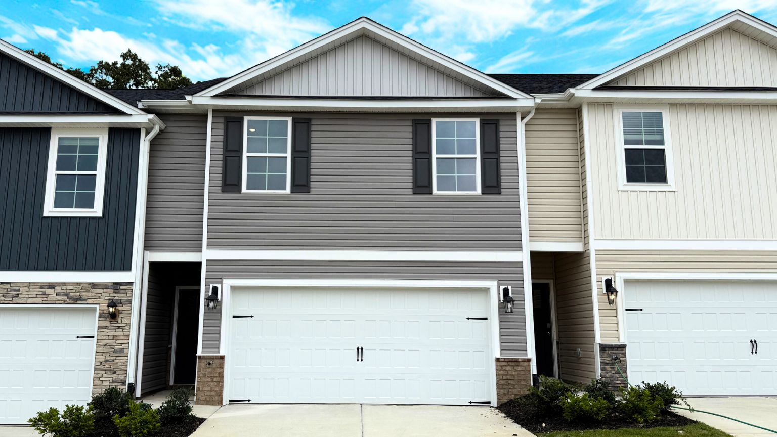 Front exterior view of townhome with 2 car garage