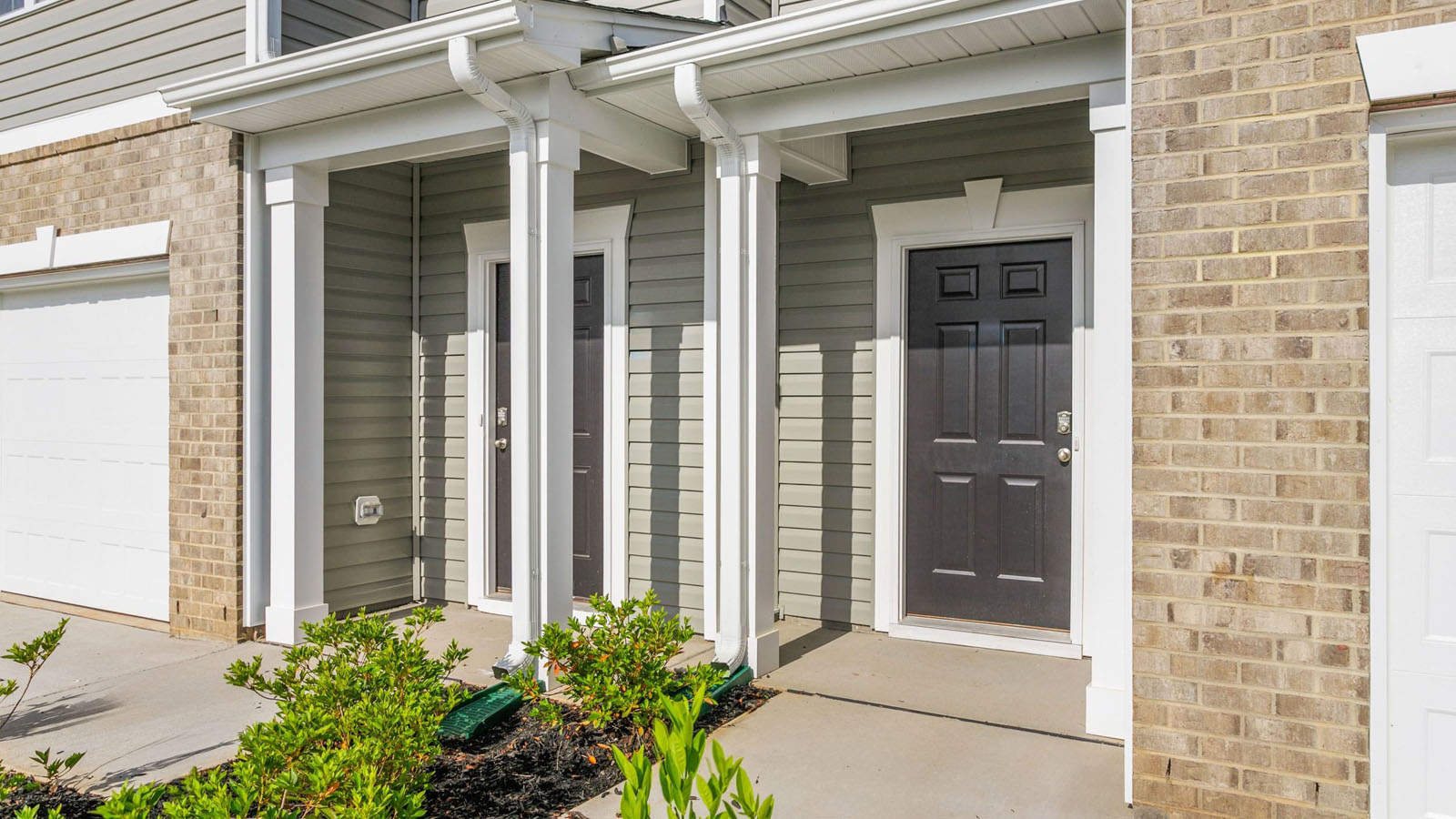 Close up of The Newton featured at Henley Ridge offers 2 story 3 bed 2.5 bath 1 car garage townhome