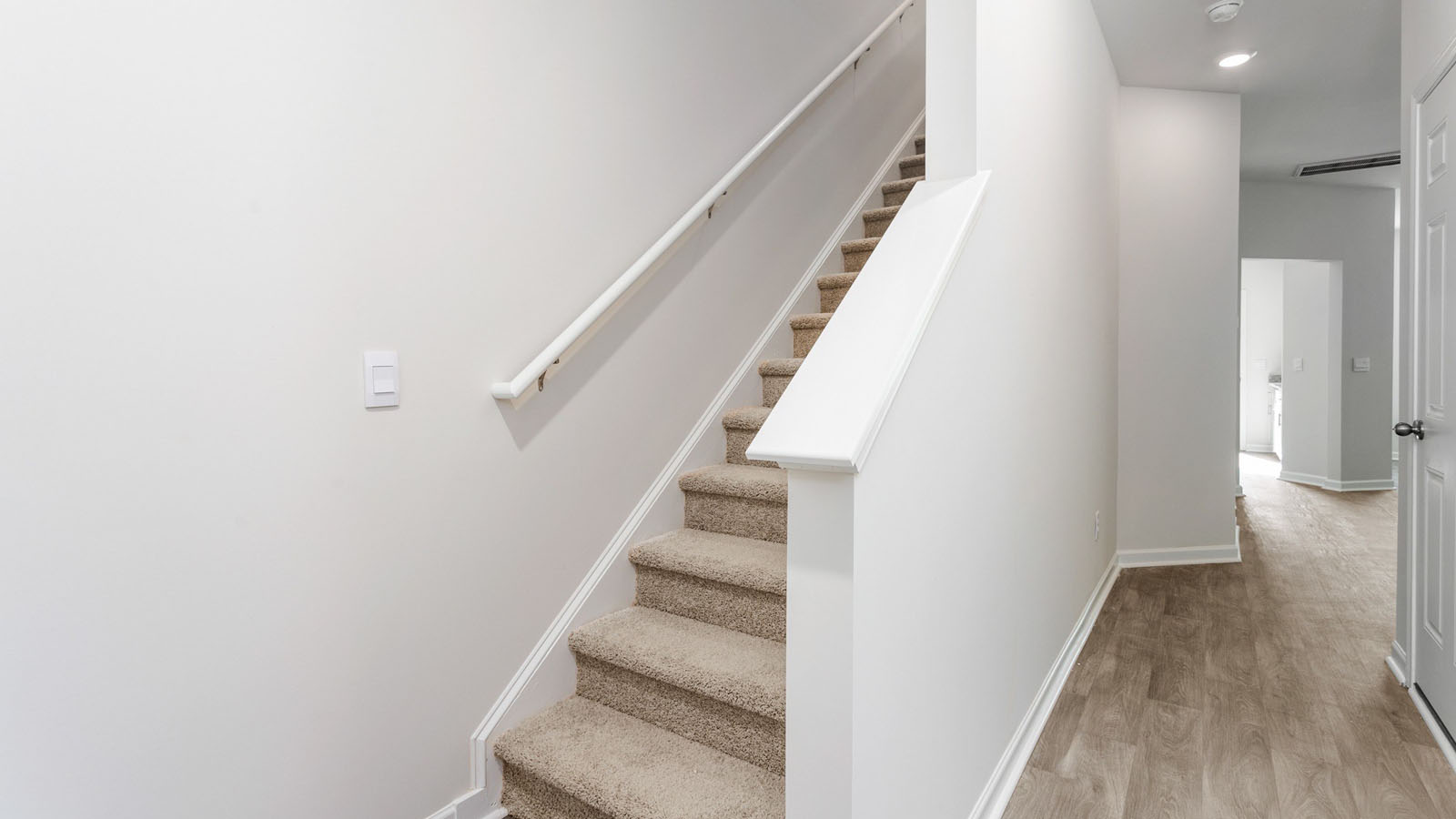 front door entrance with view of the staircase