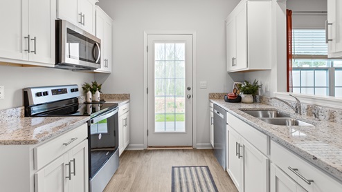 kitchen with vinyl floors and stainless steel appliances