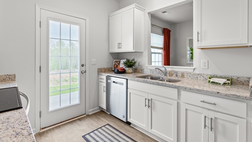 kitchen with vinyl floors and stainless steel appliances