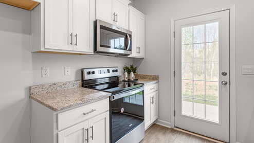 kitchen with vinyl floors and stainless steel appliances