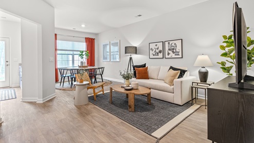 living room with vinyl floors and natural light