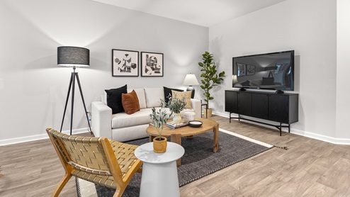 living room with vinyl floors and natural light