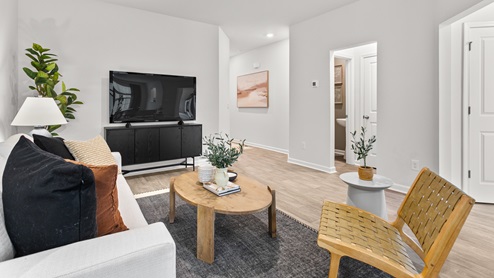 living room with vinyl floors and natural light