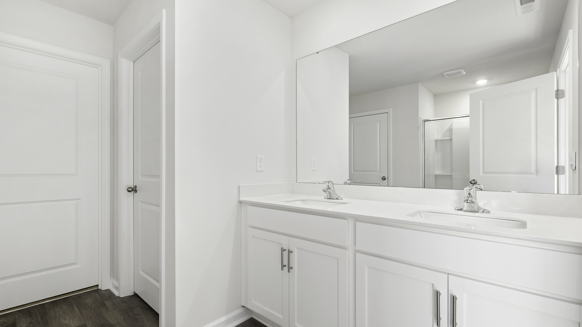 primary bathroom with dual sinks