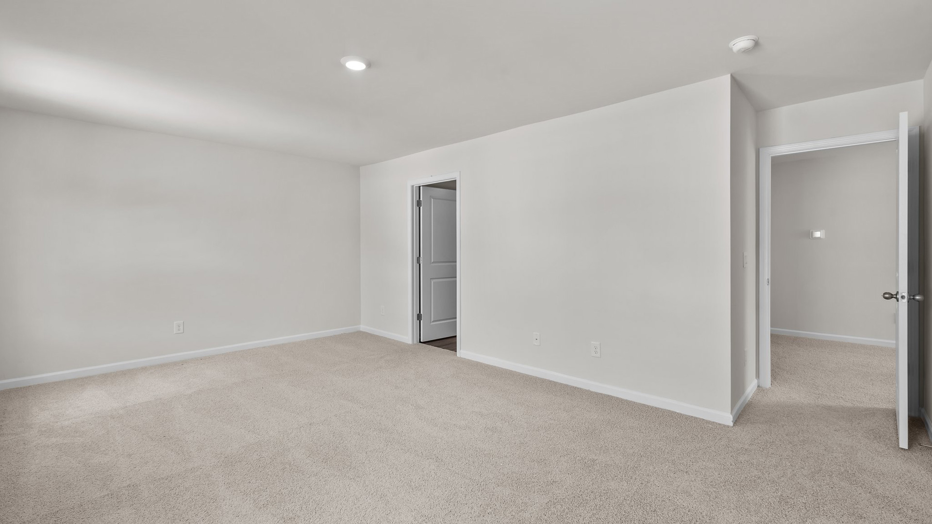 primary bedroom with carpet