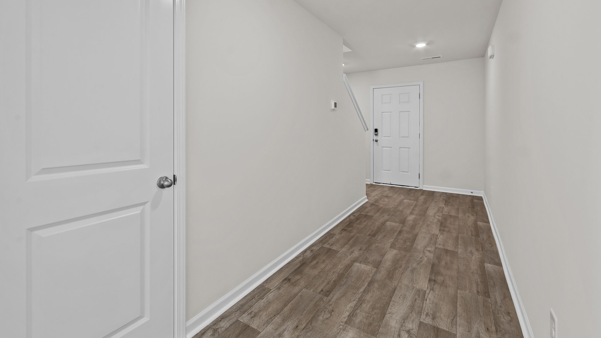 view of entryway hallway with vinyl flooring