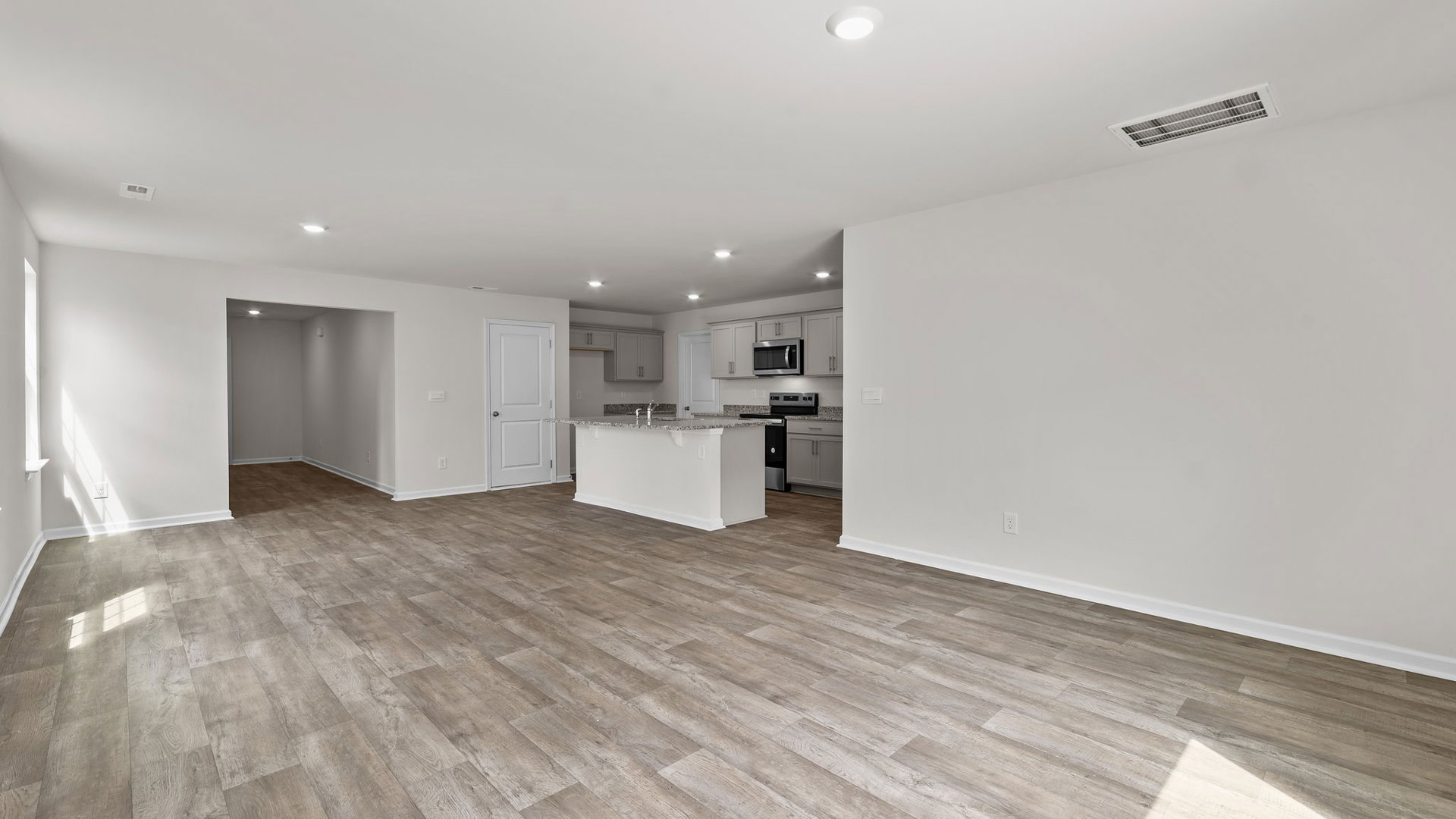 view of living room and kitchen from dining room