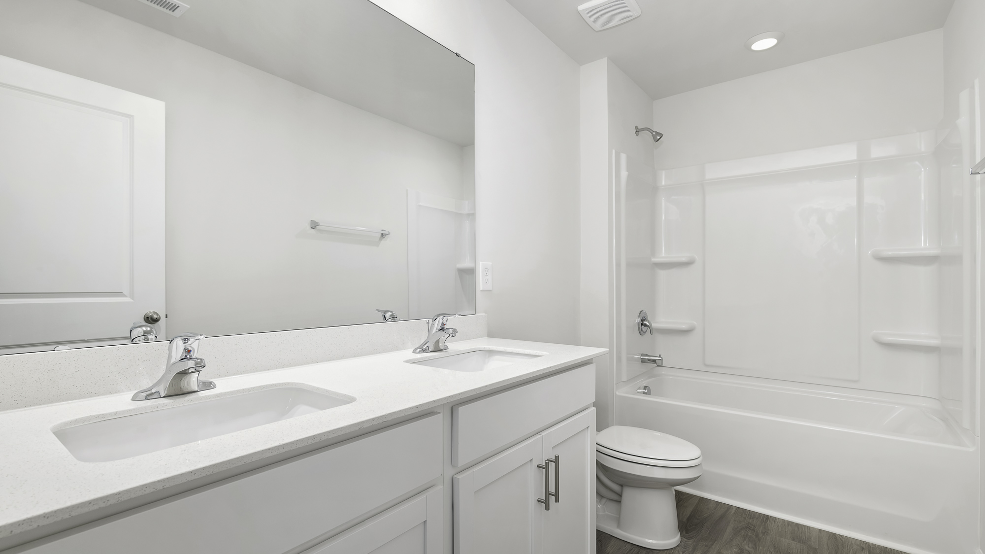 bathroom with dual sinks