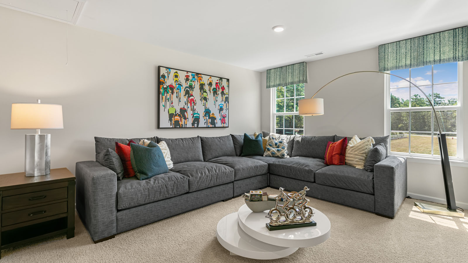 upstairs foyer/living area with carpet and ample light