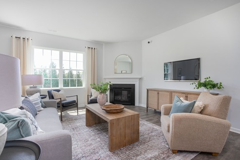 living room with revwood floors and natural light