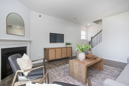 living room with revwood floors and natural light