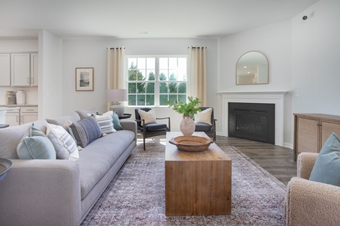 living room with revwood floors and natural light