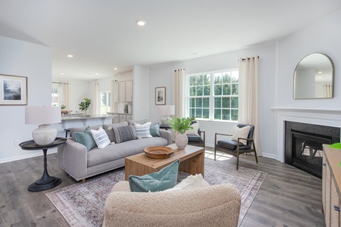 living room with revwood floors and natural light