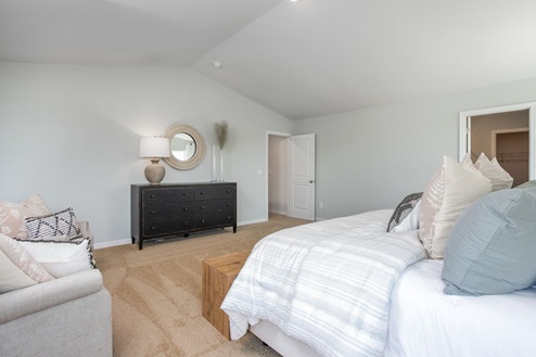 bedroom with carpet and natural light