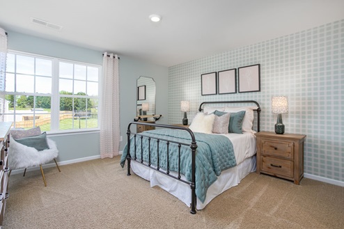 bedroom with carpet and natural light