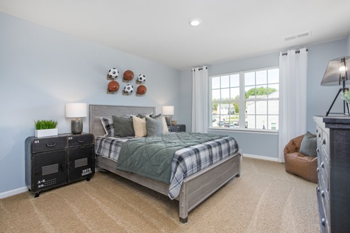 bedroom with carpet and natural light