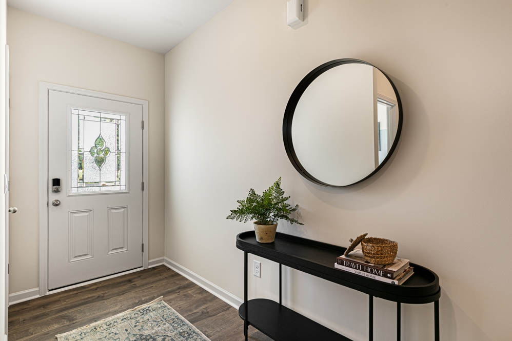 front door with revwood floors