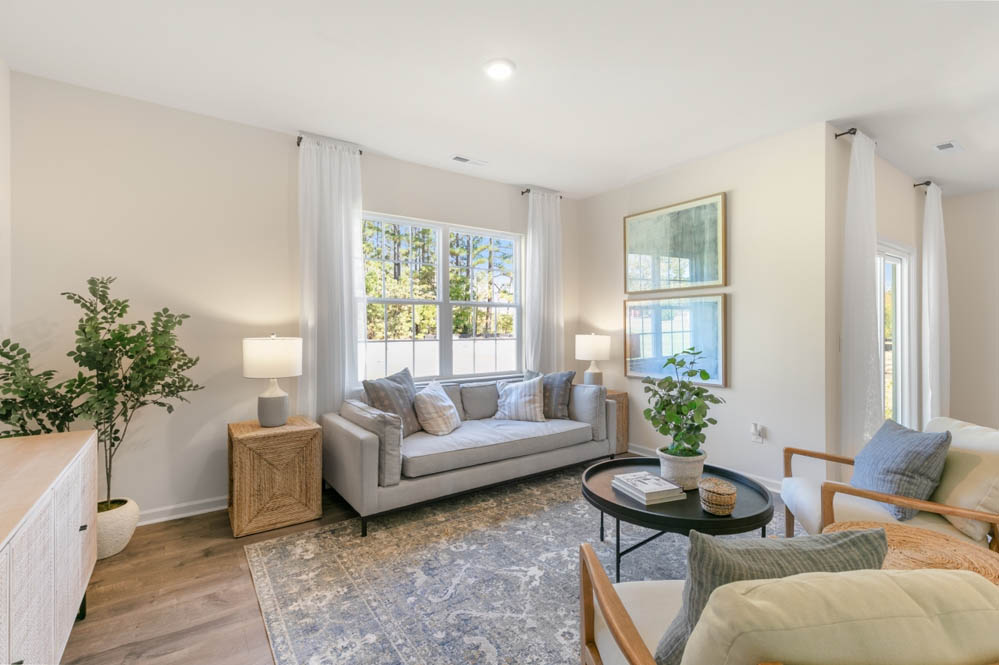 living room with revwood floors and natural light