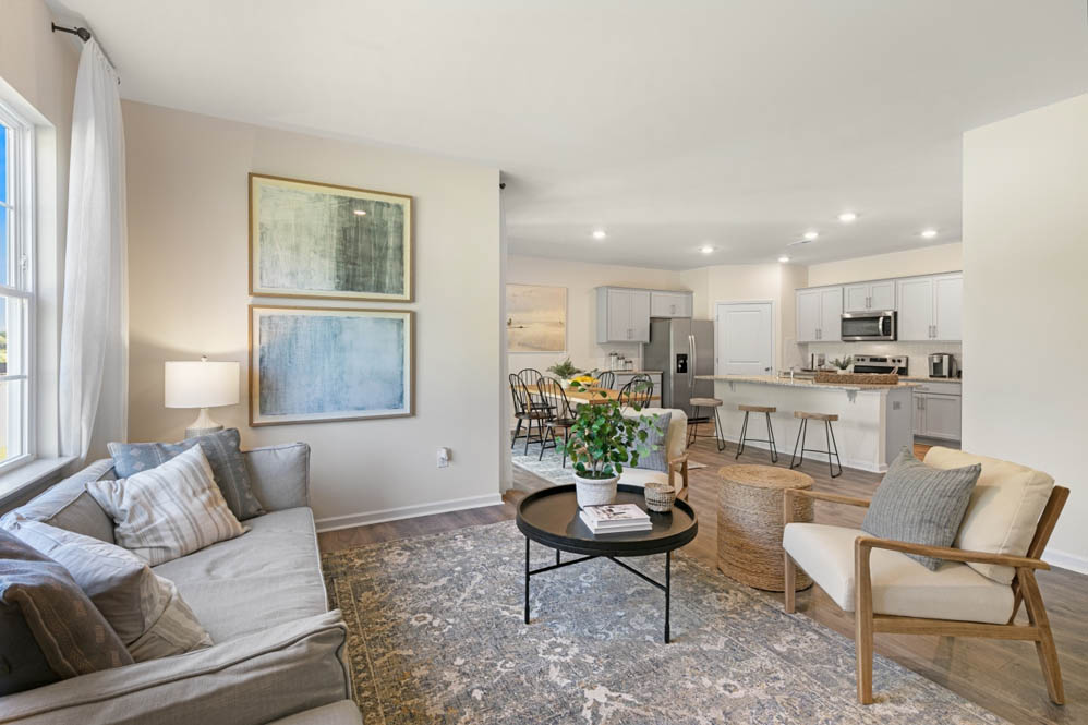 living room with revwood floors and natural light
