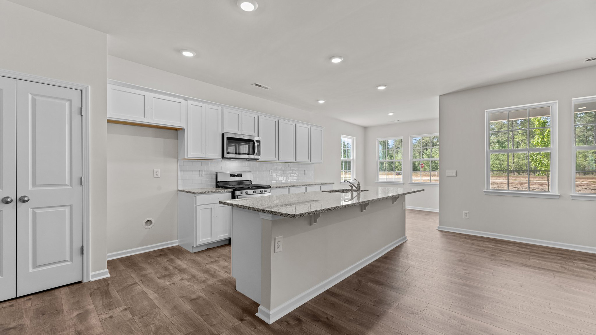 kitchen with view of dining area and living room