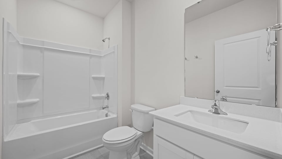 secondary bedroom with tub shower