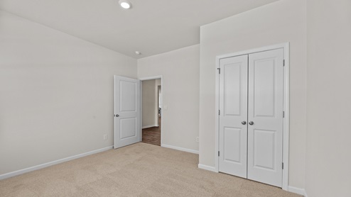 bedroom with carpet and ample light