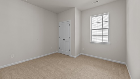 bedroom with carpet and ample light